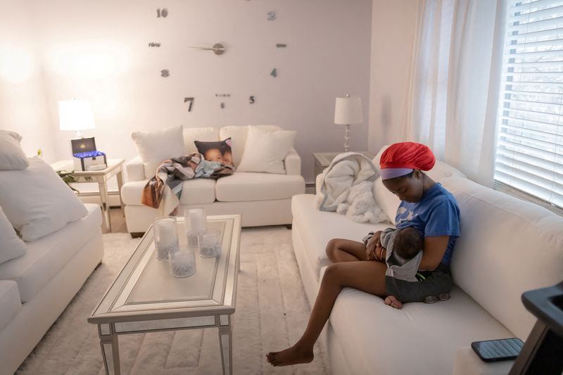 FILE PHOTO Accountant Aliyah Ponton 25 breastfeeds Savion her newborn son while she sits in her living room in Sparta New Jersey U.S. February 25 2023.     REUTERSJoy MaloneFile Photo