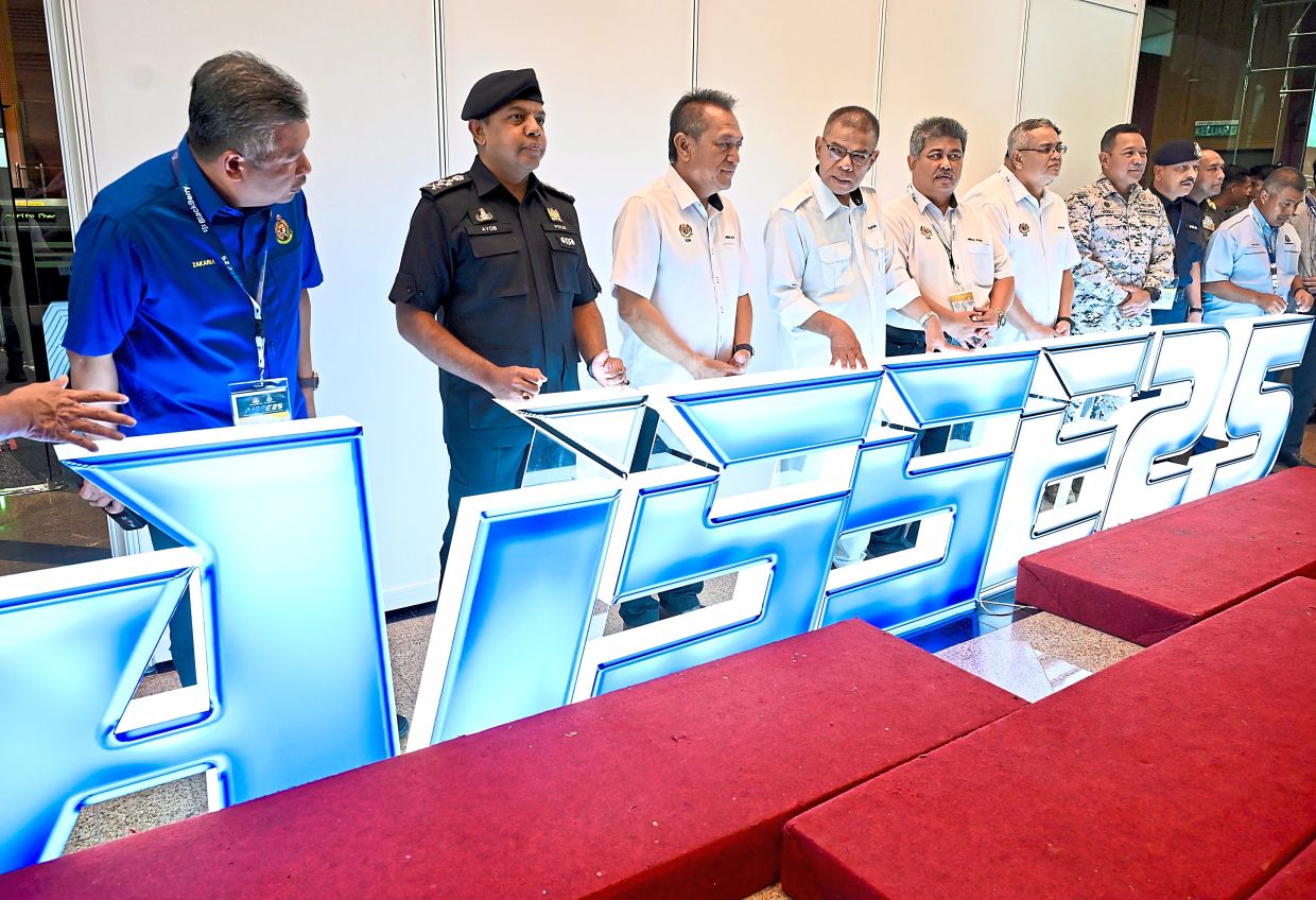 On the ground: Saifuddin Nasution (fourth from left) checking on the preparations for the AISSE at PICC in Putrajaya. — RAJA FAISAL HISHAN/The Star