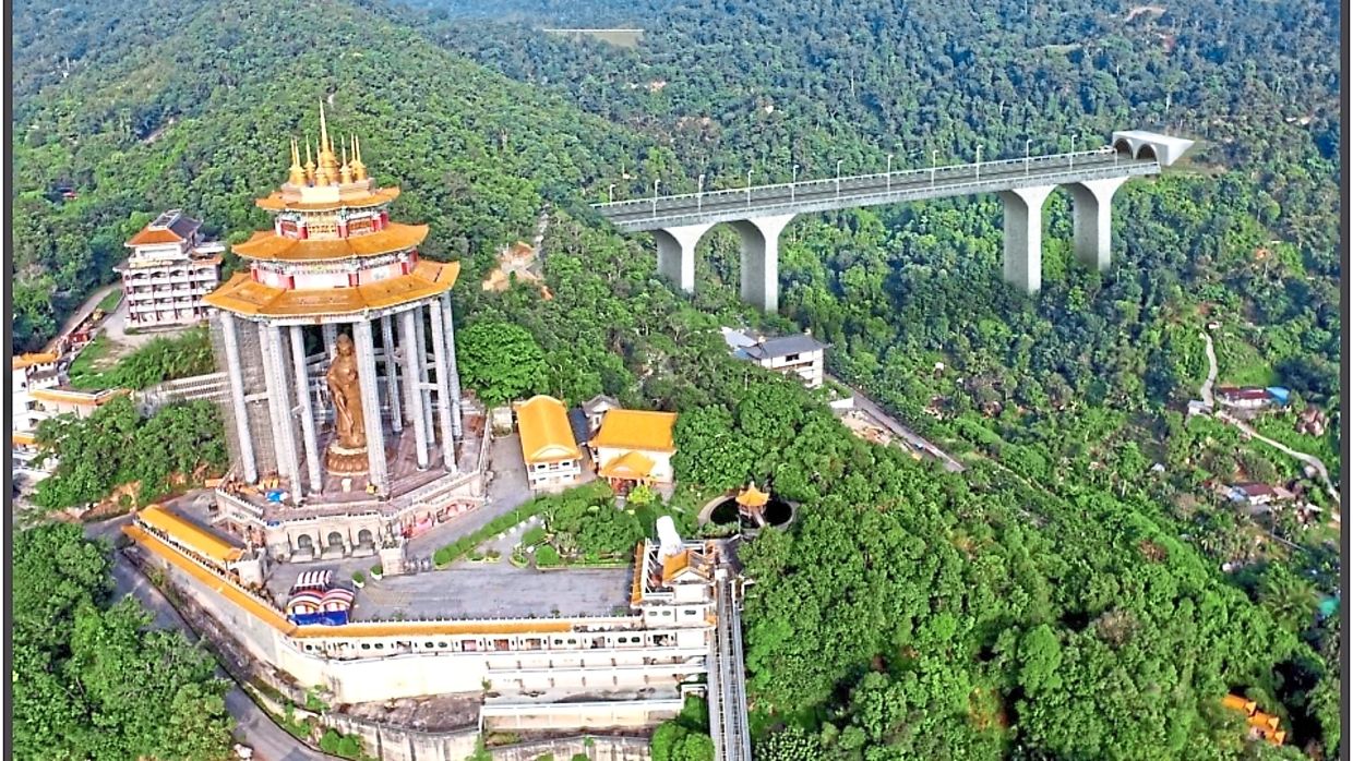 An artist’s impression of the planned Pan Island Link I (right) near Kek Lok Si Temple in Penang as an elevated highway. The project has yet to take off and continues to receive objections from civil society.