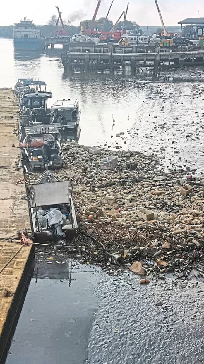 Waste accumulated at low tide near RSYC. — Courtesy photo