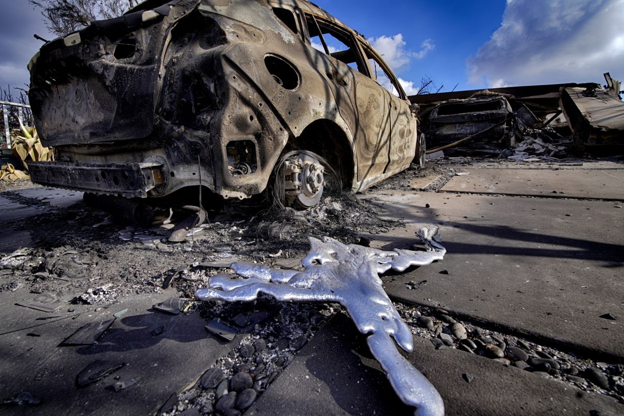 Melted metal and burned out cars sit destroyed in a driveway of a home burned by the wildfire that spread through the Pacific Palisades neighbourhood of Los Angeles on Jan 17. Photo: AP