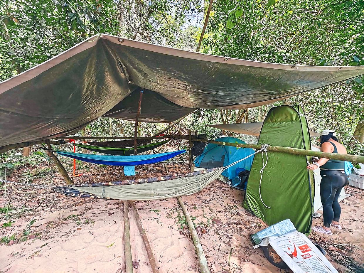 On this trip, the gents slept in hammocks and the ladies slept in tents. The green enclosure on the right is a pop-up dressing room.