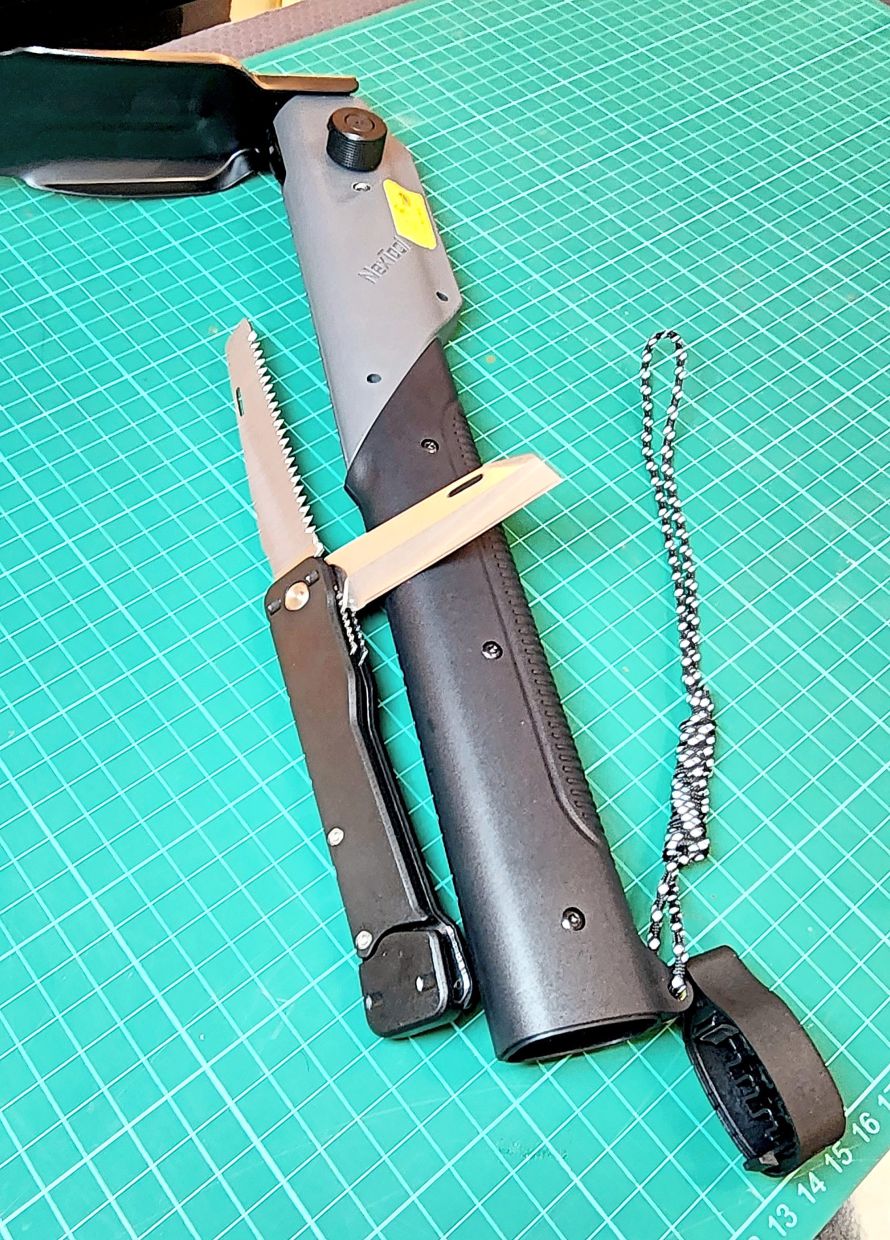 A folding saw plus knife is hidden inside the handle.