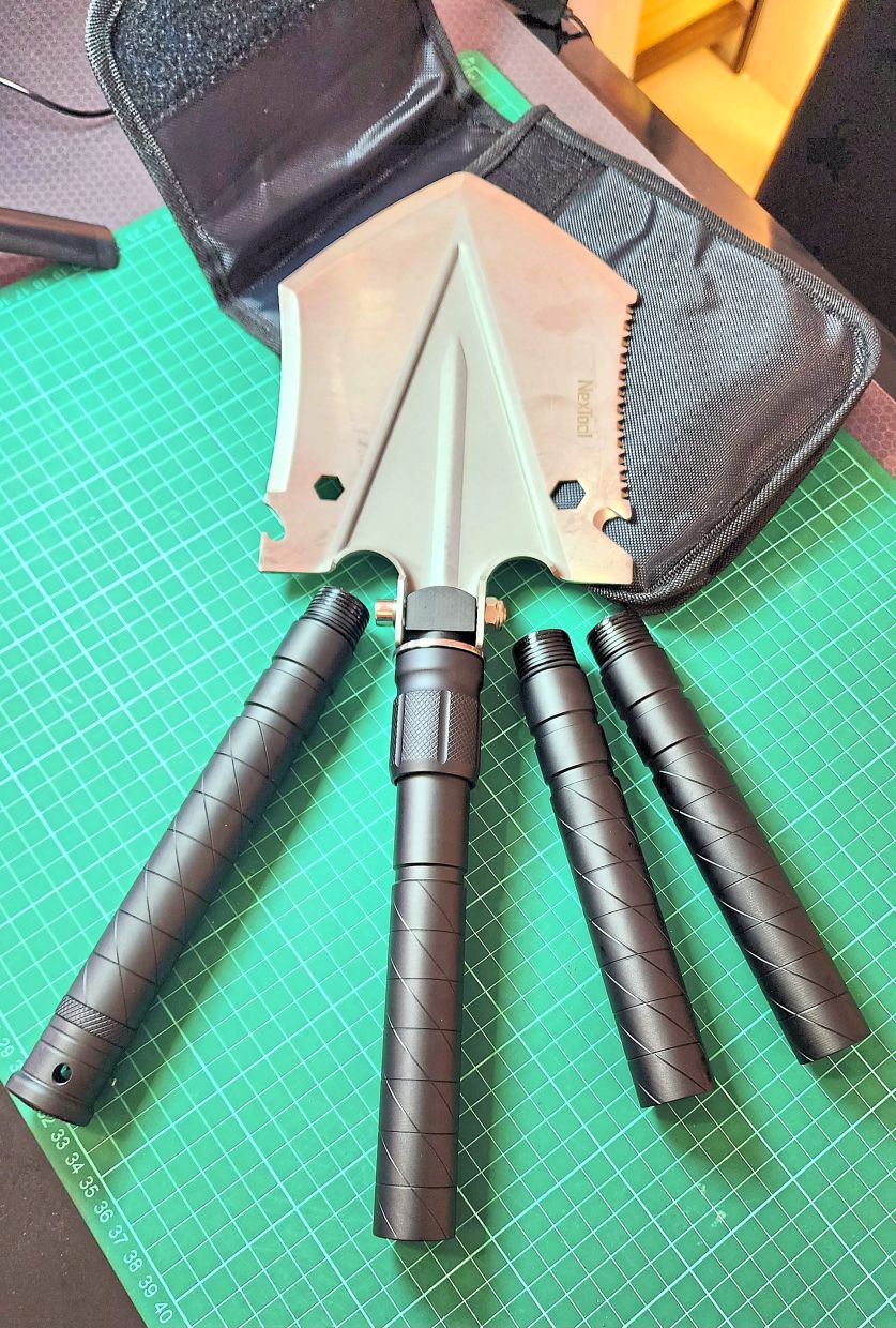 This survival shovel with a 76cm long handle breaks down into a small pack that you can wear on your belt.