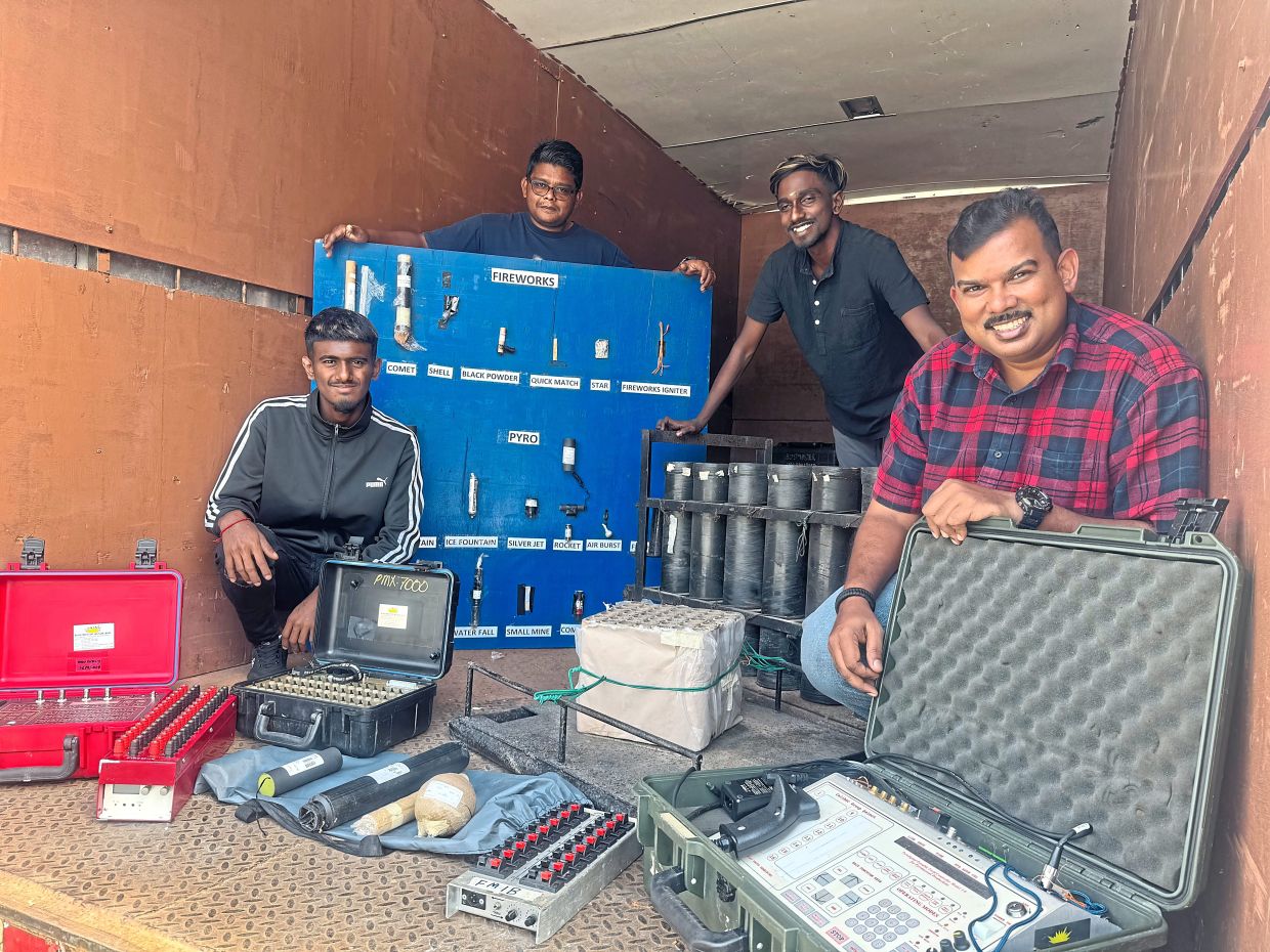 Krishna (right) with the crew who set up the fireworks display ahead of the Putrajaya New Year’s Eve countdown to 2025.