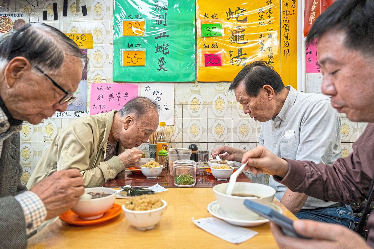 Traditional dish: Customers dining at the restaurant in Hong Kong. — AP