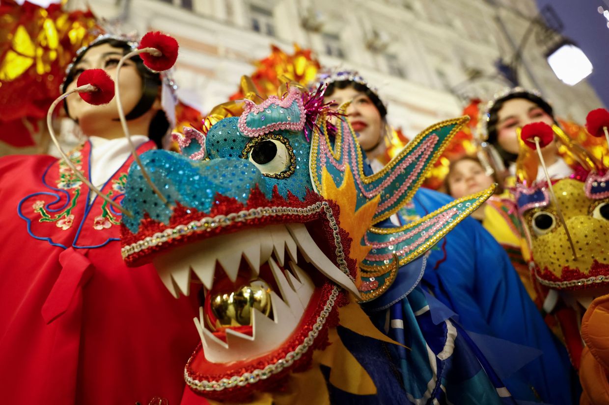 Participants perform during the celebration on the eve of the Lunar New Year in Moscow on Jan 28. Photo: Reuters