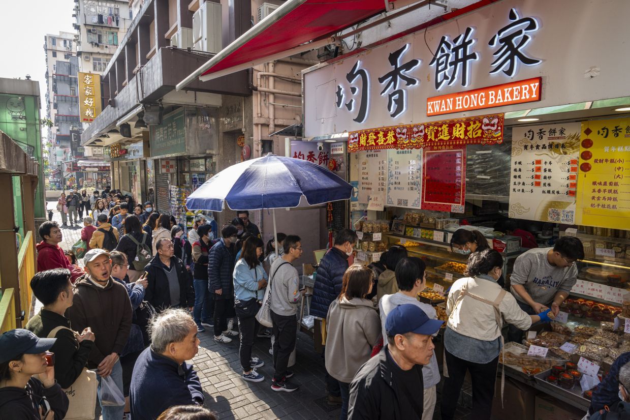 A long line forming outside Kwan Hong Bakery in Hong Kong, on Jan 18, 2025. - AP 