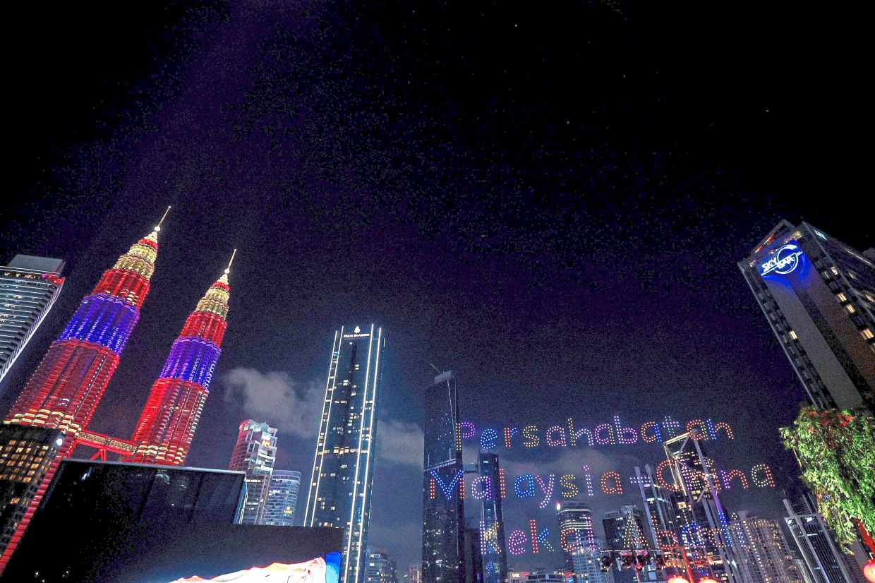 Flying in formation: The recent Kuala Lumpur drone display, where over a thousand drones formed celebratory phrases, reflect the ties forged between China and Malaysia, says Ahmad Zahid. — Bernama