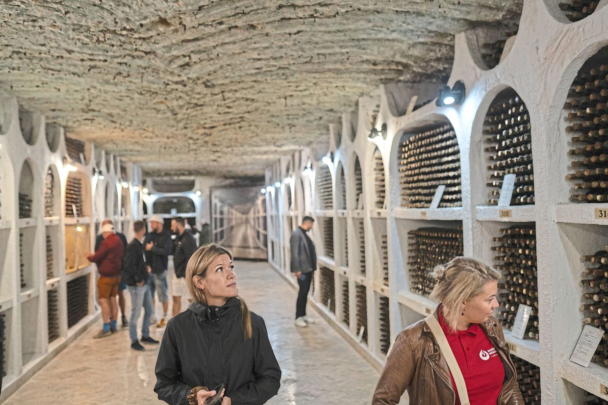 Visitors touring the wine cellars at Cricova Winery. — ©2025 The New York Times Company