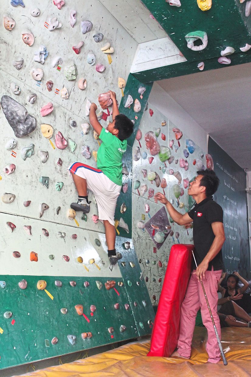 Bouldering is so safe even children can give it a go ... with proper supervision, of course. — Photos: Filepics