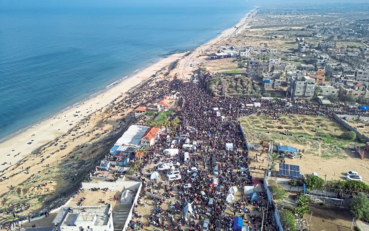 “I looked at a picture of Gaza,” he said, “Gaza is like a massive demolition site.” (top) Trump spoke glowingly, however, of Gaza’s “phenomenal location on the sea, best weather.” He said, “Some beautiful things could be done with it.” — Photos: AP
