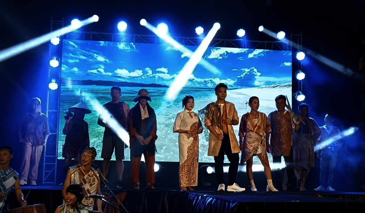 Villagers modelling a variety of designs including fishermen’s shirts dyed with mangrove bark extract during a fashion show.