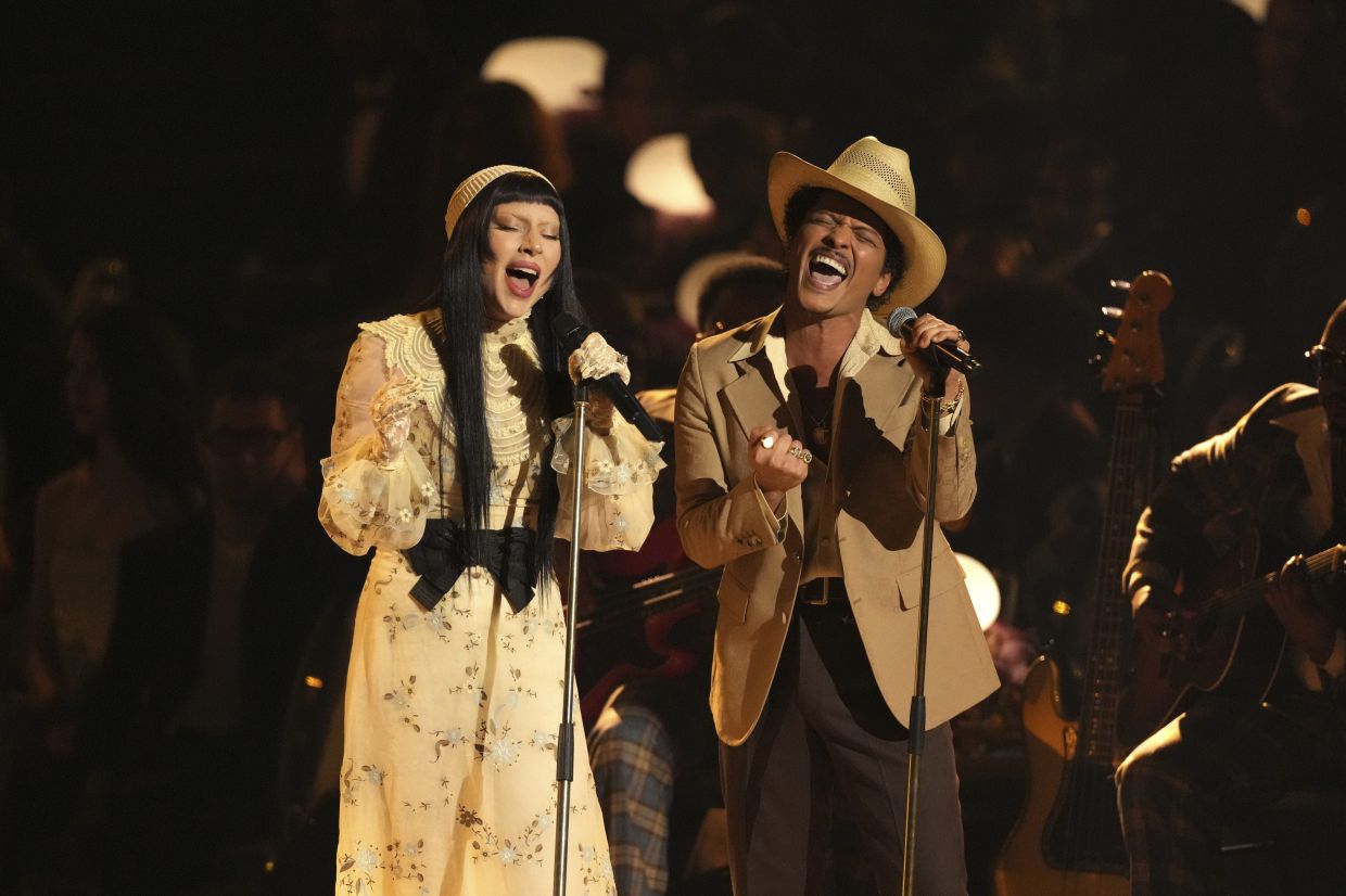 Lady Gaga, left, and Bruno Mars perform 'California Dreamin'' during the 67th annual Grammy Awards: Photo: AP