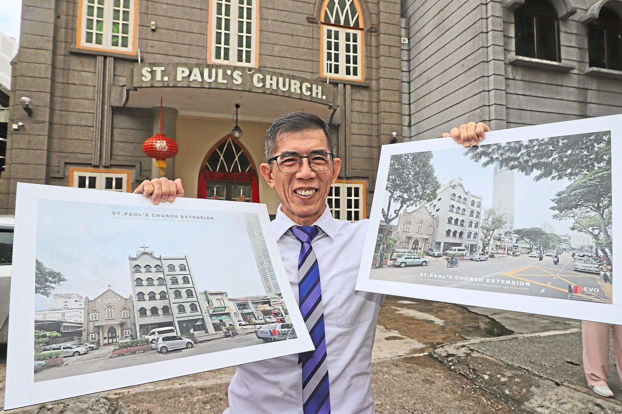 (Left) Soon holding up artist impressions of Wisma Huai En which will be built next to the current church buildings (background). — LIM BENG TATT/The Star