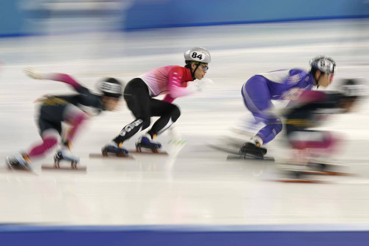 Singapore Yan Kai Brandon Pok, second from left, competes during the men's 1500m finals B at the Short Track Speed Skating during the 9th Asian Winter Games in Harbin, China. - AP