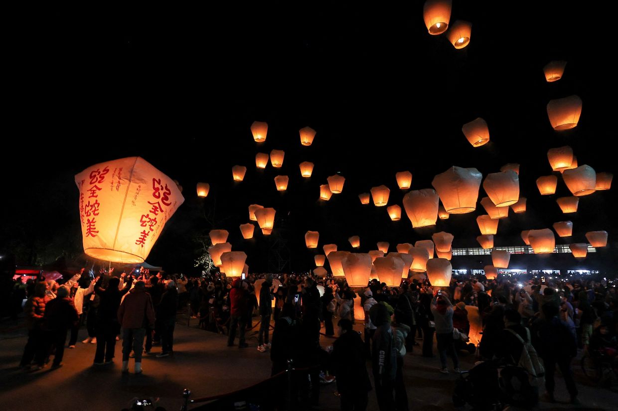 People release lanterns to celebrate the Lantern Festival in New Taipei City, Taiwan. - Reuters