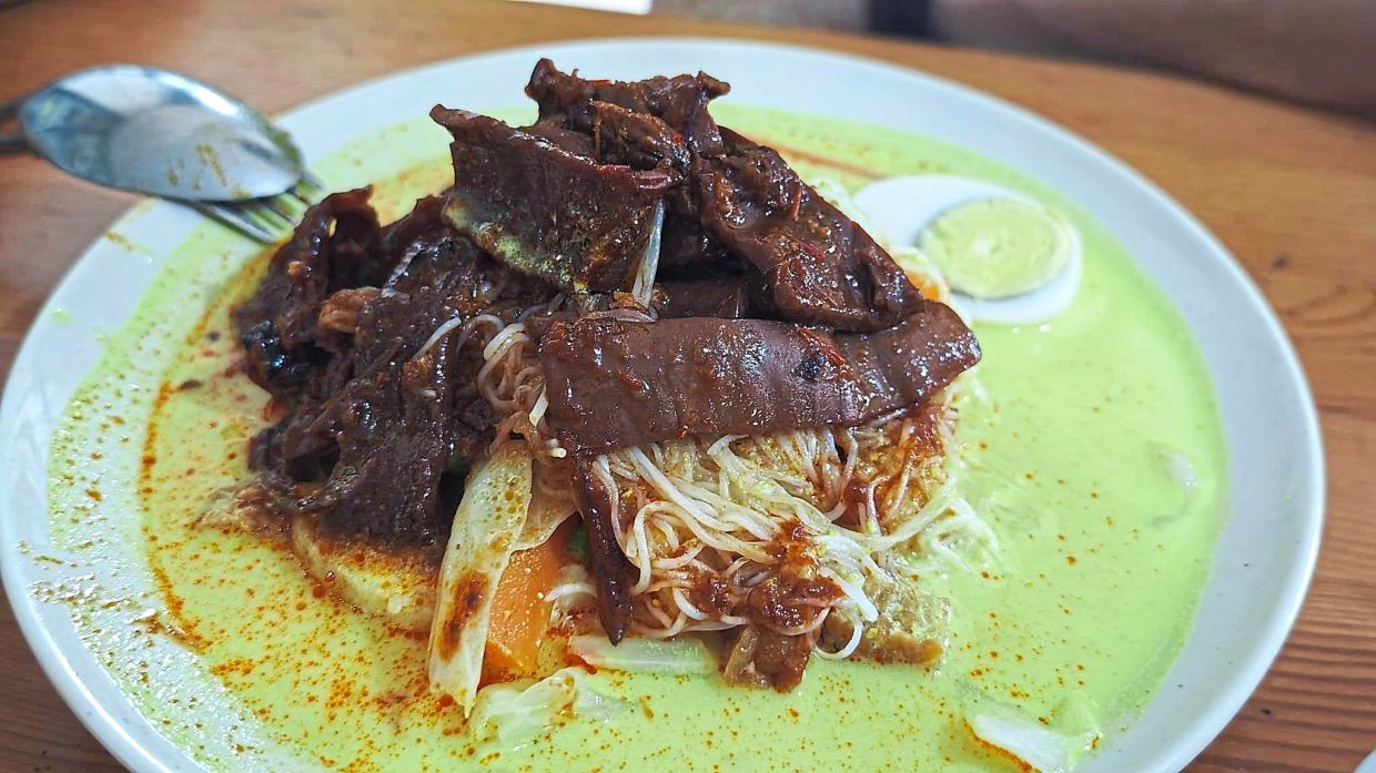 Lontong with kari sotong kering is one of the more sought-after meals along this route.