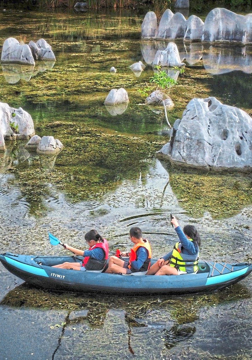 Even children can comfortably paddle around this sheltered karst pond.