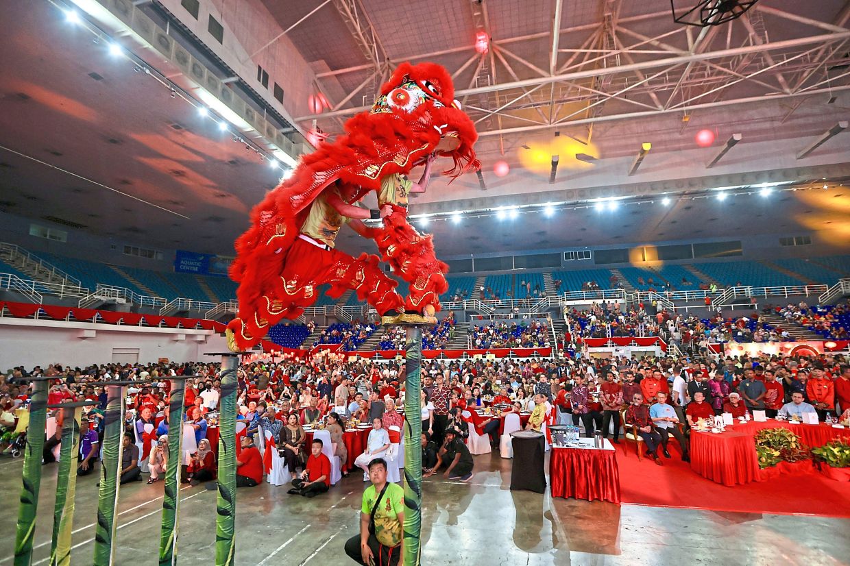 Lion dancers performing on stilts at Chief Minister Chow Kon Yeow’s Chinese New Year open house at Setia SPICE Convention Centre.