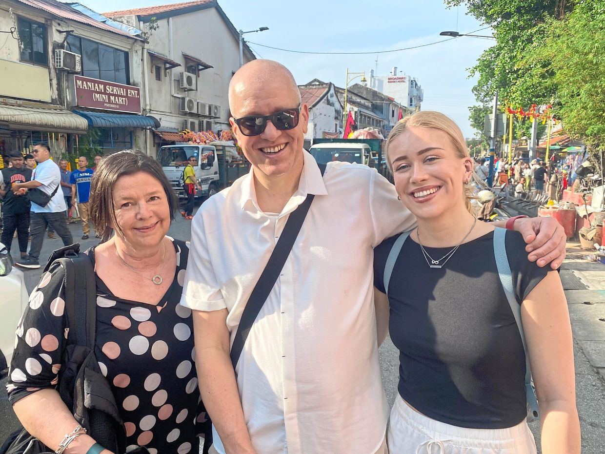 Nienhaus (centre) with Anke (left) and Jordi at the Penang Chinese Town Hall Open House in Jalan Masjid Kapitan Keling.