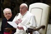 Pope Francis, in hospital, has 'slight fever' but is stable, Vatican says