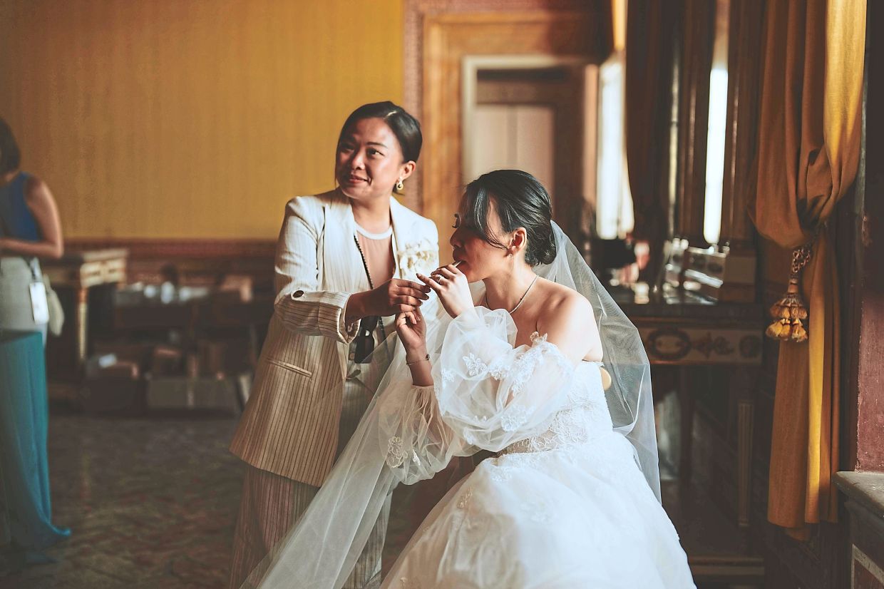 Ngui (left) has planned over 200 weddings for foreign couples in Malaysia. — NGUI SHEAU HANNG