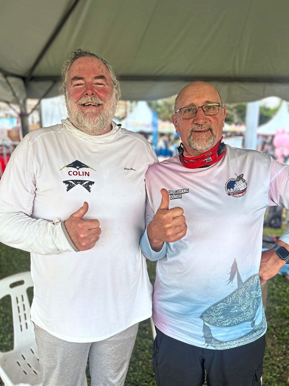 Wilson (left) with his kite partner Dilucca loving the local kite culture in Pasir Gudang.