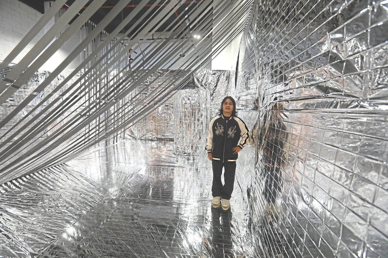 Zulkefli Jais is showing his new installation 'A Promised Freedom?' at the 'kam.ceng' exhibition in Petaling Jaya. Photo: The Star/Azlina Abdullah 