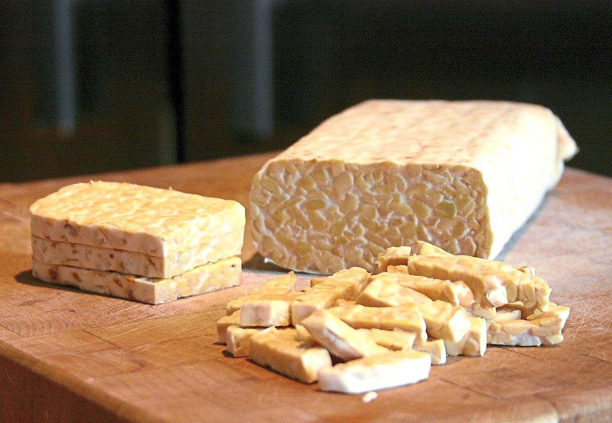 Tempeh is an example of a local food that contains probiotics. — Wikimedia Commons