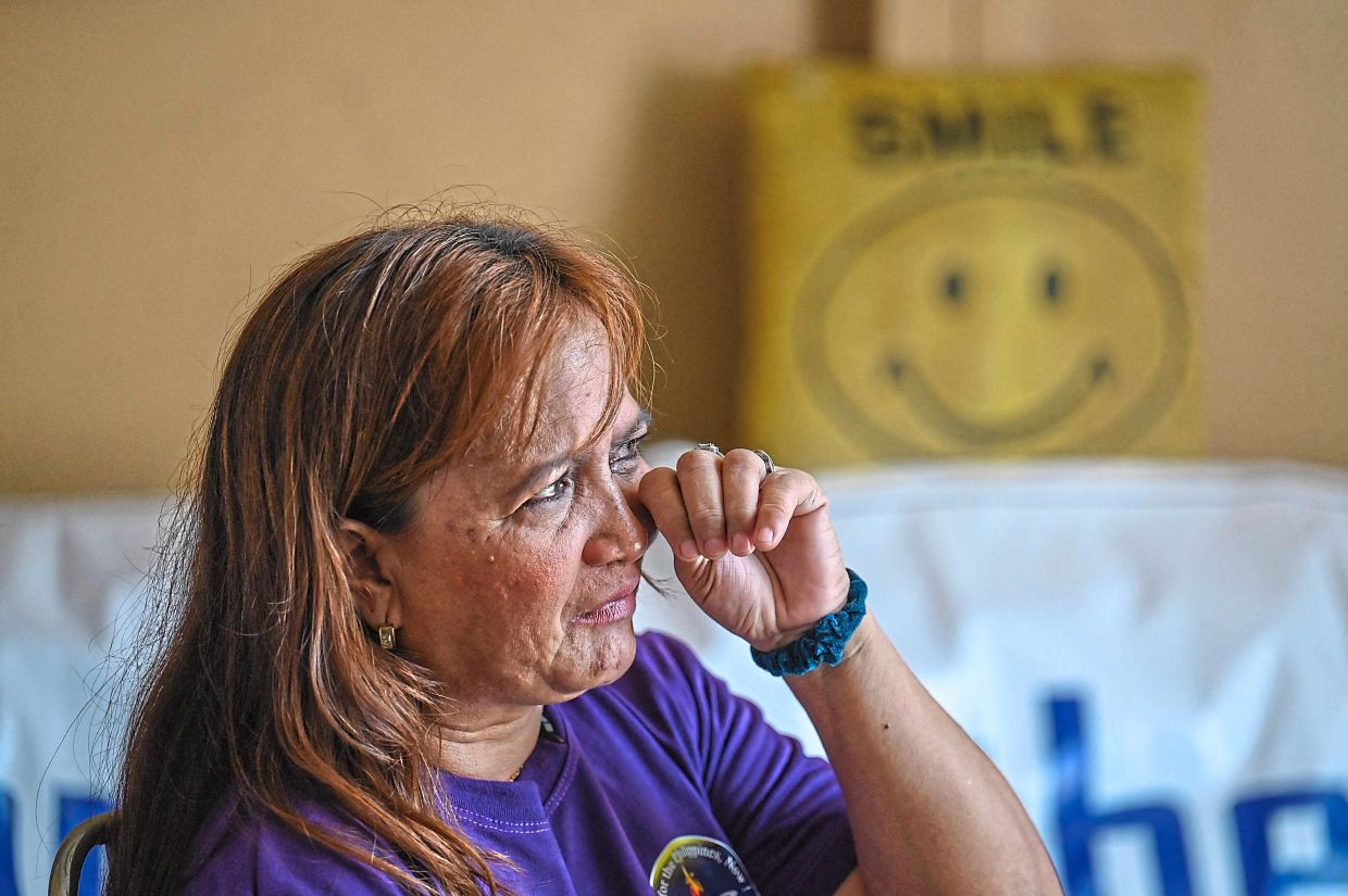 Years of struggle: Anuran shedding tears during an interview in Quezon City, Metro Manila. — AFP