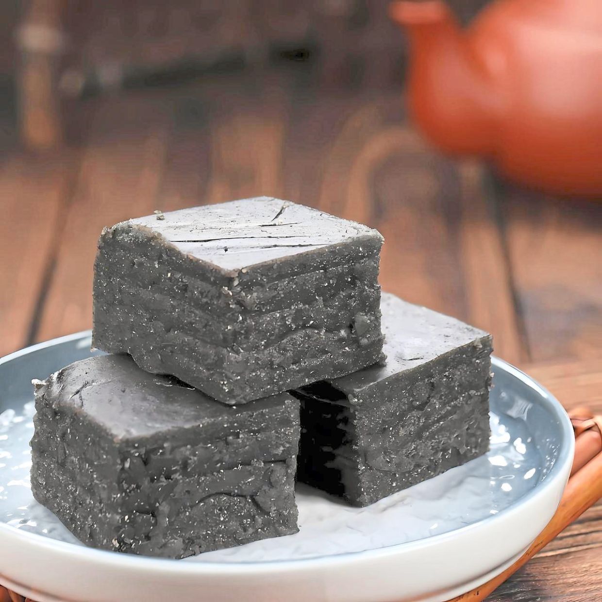 The steamed black sesame layer cake is a celebration of tradition and texture.