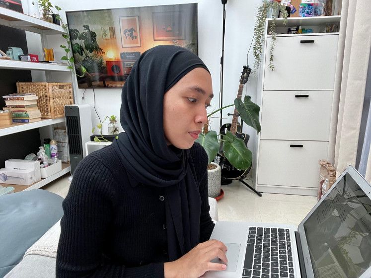 Being mindful: Fika reviewing her financial spending. — Courtesy of Ammar Fika Abdillah/The Jakarta Post/Asia News Network
