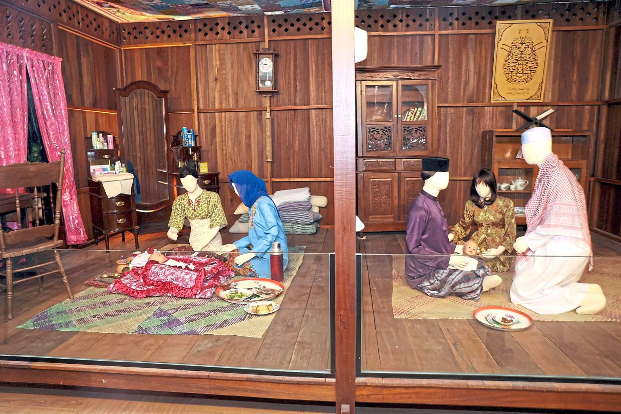Dioramas showcase life in a Malay kampung setting.