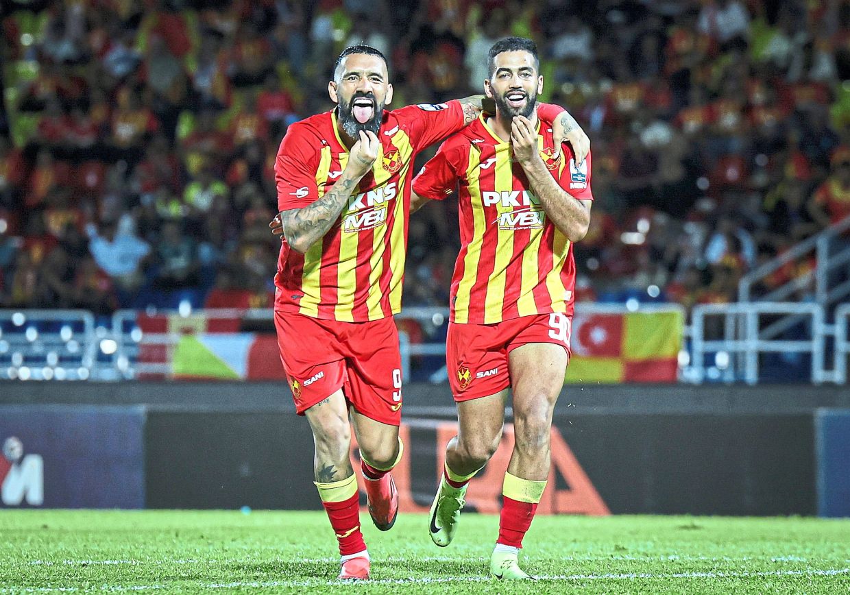 Ali Olwan (right) celebrating after scoring with Ronnie Fernandez. -Bernama