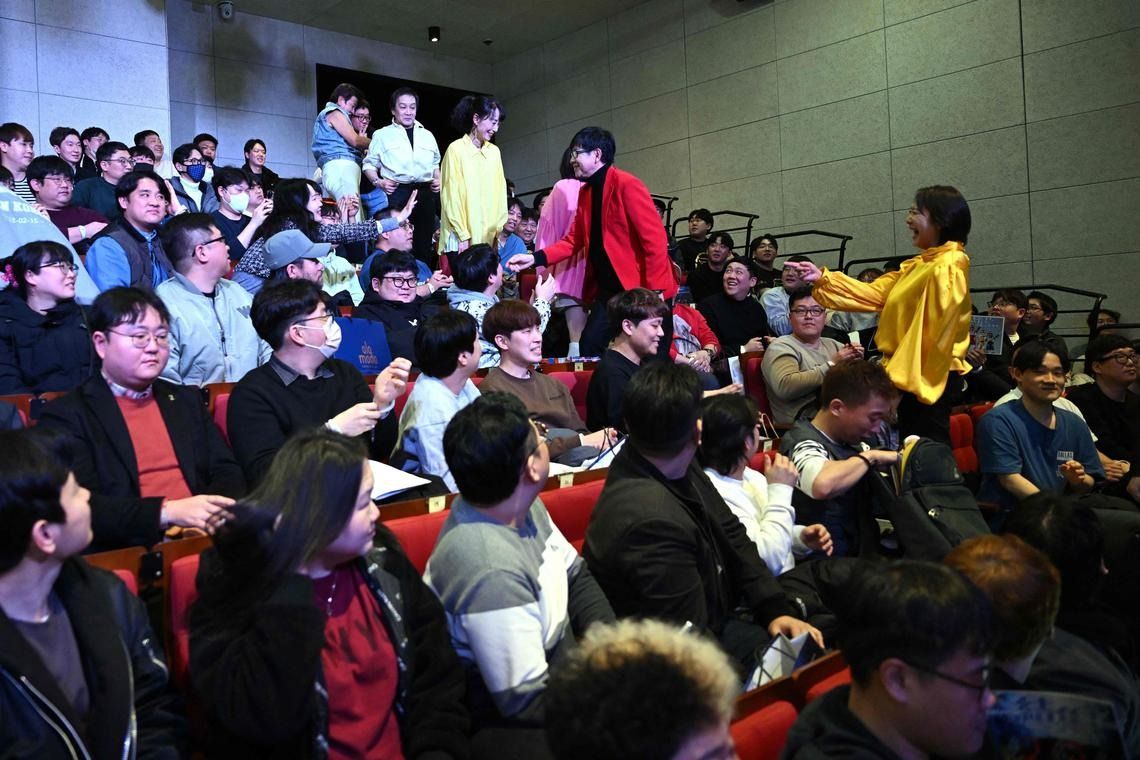 Cast members of Japanese superhero series “Choudenshi Bioman” and “Hikari Sentai Maskman” attending a fan meeting in Seoul. - AFP