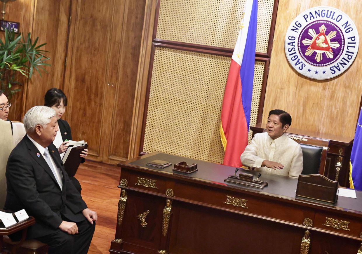 Philippine President Ferdinand Marcos (right) attends a meeting with Japan's Defense Minister Gen Nakatani at the Malakanang presindential palace in Manila on Monday, February 24, 2025. - Photo by FRANCIS R. MALASIG / AFP