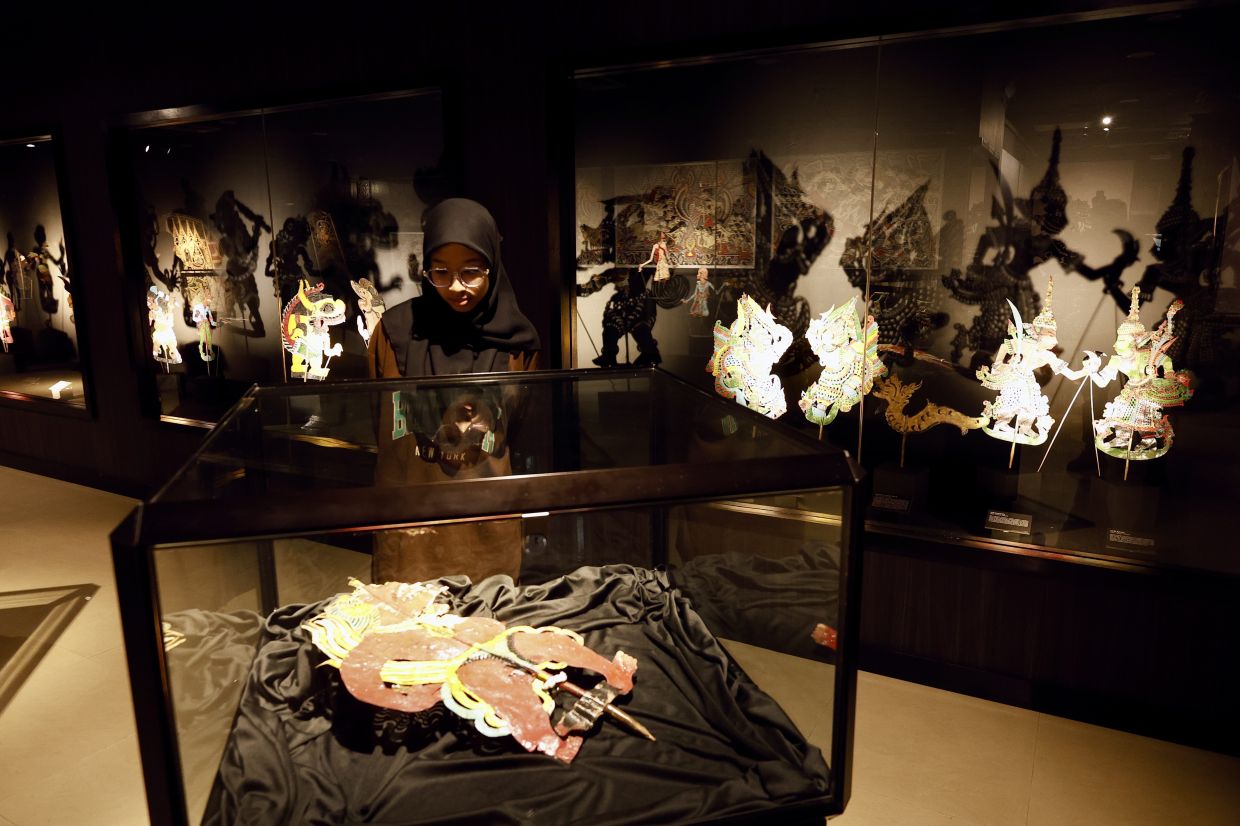 These wayang kulit characters, once animated by Dalang Dollah Baju Merah's masterful storytelling, now stand as enduring symbols of Malaysia’s rich shadow theatre tradition, presented alongside regional counterparts that highlight the deep cultural ties across South-East Asia. Photo: The Star/Faihan Ghani