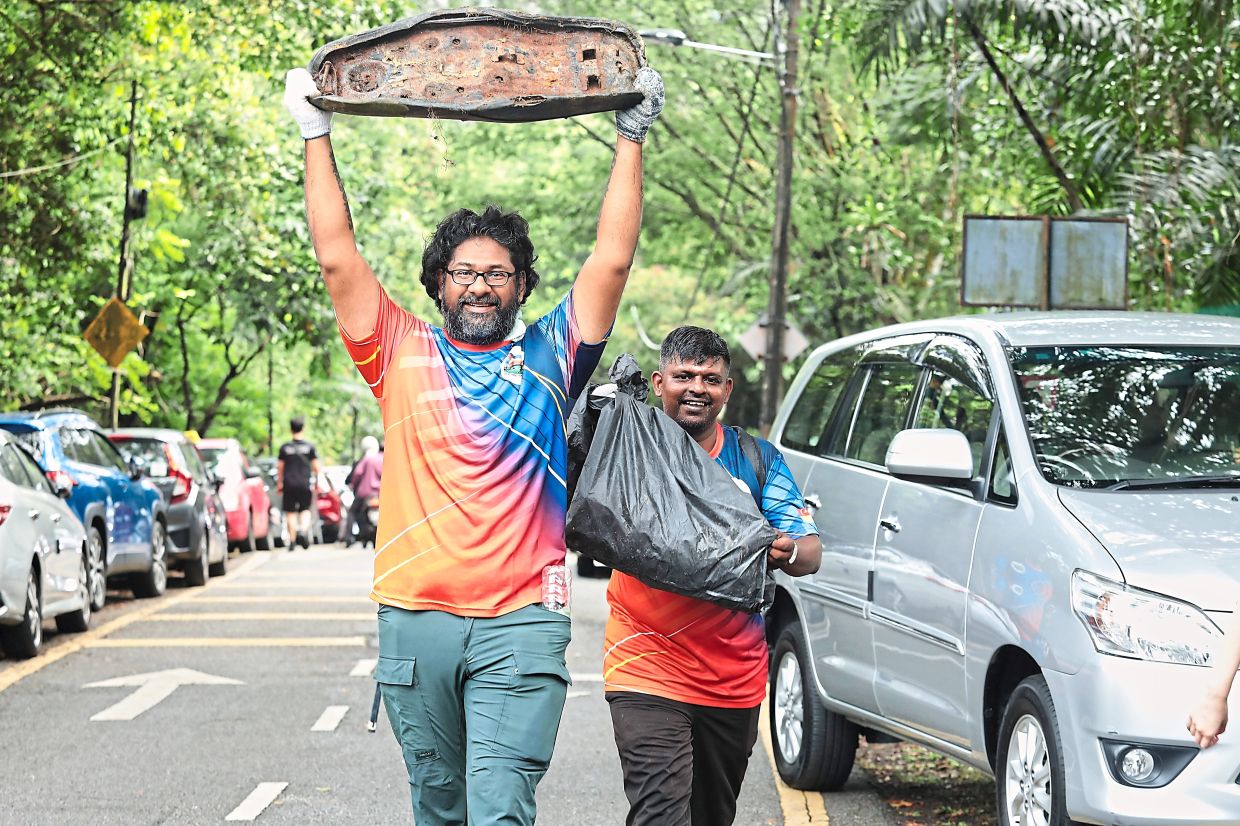 Volunteers happy to help clear rubbish around Bukit Gasing.