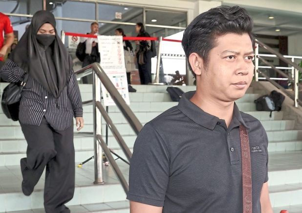 Awaiting a decision: Zaim Ikhwan and Ismanira leaving the Shah Alam High Court. — KK SHAM/The Star