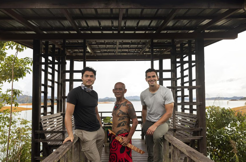 Henry Golding (left) and Antoni Porowski (right) with a member of the Iban tribe in Borneo in 'No Taste Like Home With Antoni Porowski'. Photo: Handout