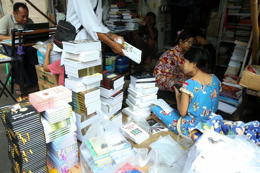 A staff works at a bookshop in Yangon, Myanmar, Feb 24, 2025. - Photo: Xinhua