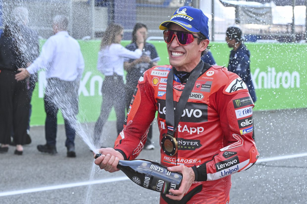 Spain's rider Marc Marquez celebrates after winning the MotoGP sprint race at the Chang International Circuit in Buriram, Thailand, Saturday, March 1, 2025. -- AP Photo/Kittinun Rodsupan