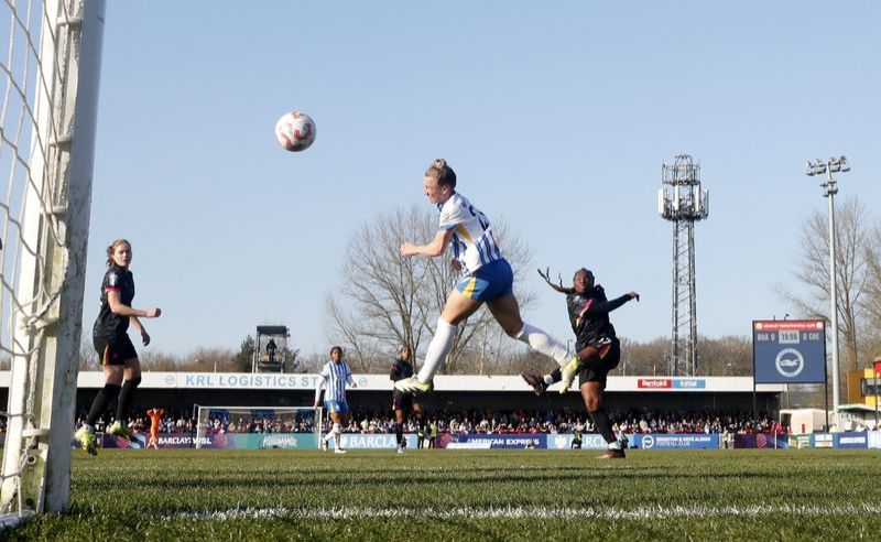 Soccer-Chelsea salvage WSL draw at Brighton, Man Utd close the gap