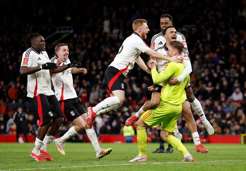 Soccer-Fulham upset holders United in FA Cup fifth-round shootout