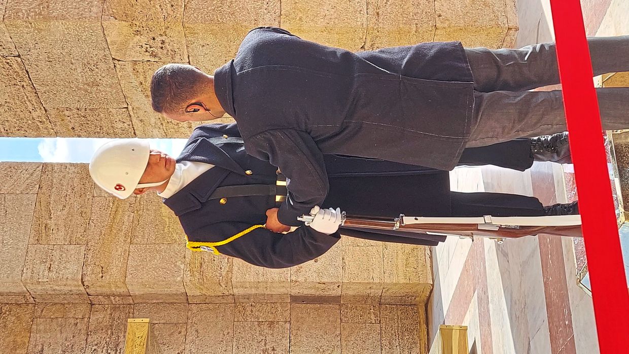 At Anitkabir, Ankara, the reader captured this picture of a security officer adjusting the uniform of a guard.