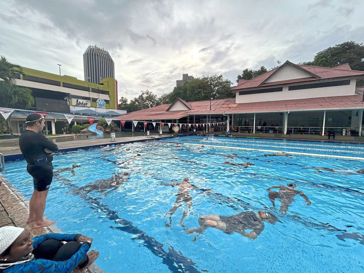 Yeap (standing) training coaches for the swim certification course at the then PJ Palms Sports Centre. The school has since moved out due to higher rentals following a change in management. — Courtesy pic