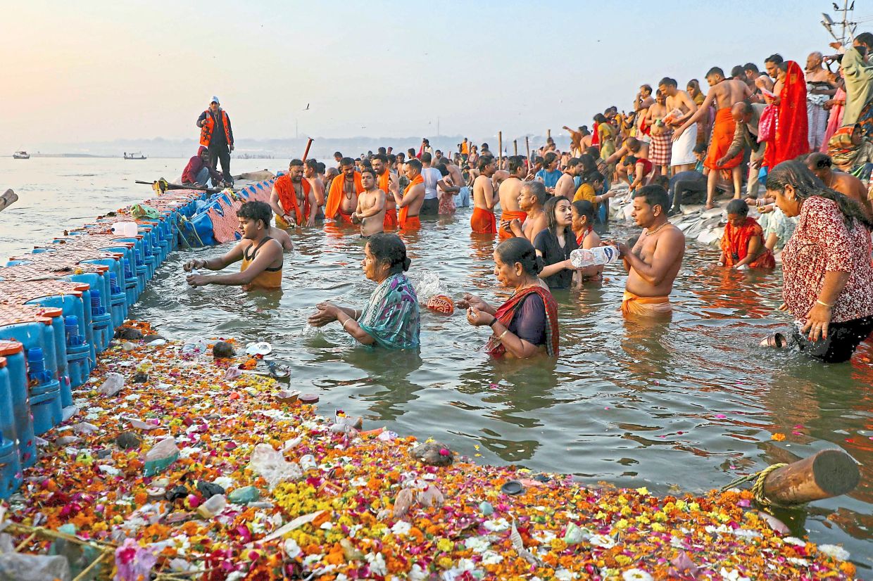 Pilgrims taking a holy dip in Sangam, the confluence of Ganges, Yamuna and mythical Saraswati rivers, on the occasion of Maghi Purnima during the Maha Kumbh Mela in Prayagraj. - AFP