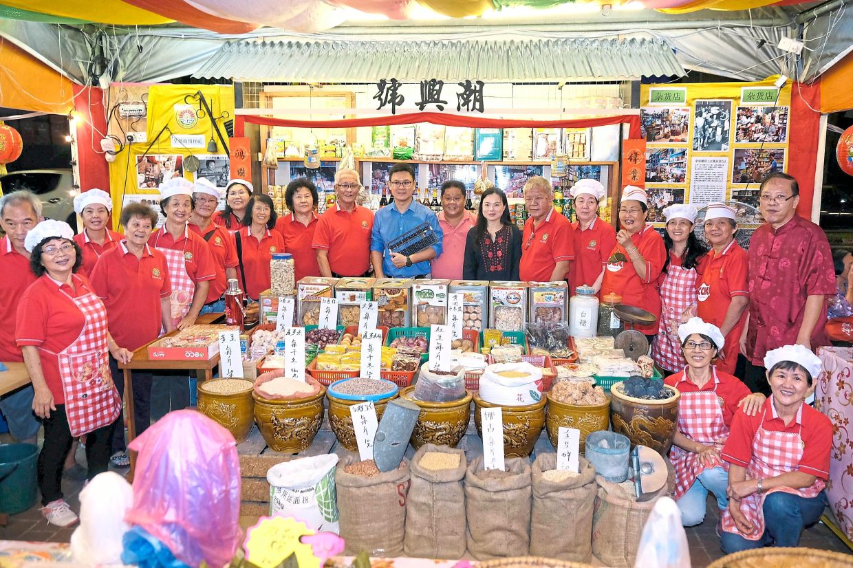 Teochew Association Sibu members taking part in the annual Borneo Cultural Festival with a stall showing dried goods in a sundry shop.