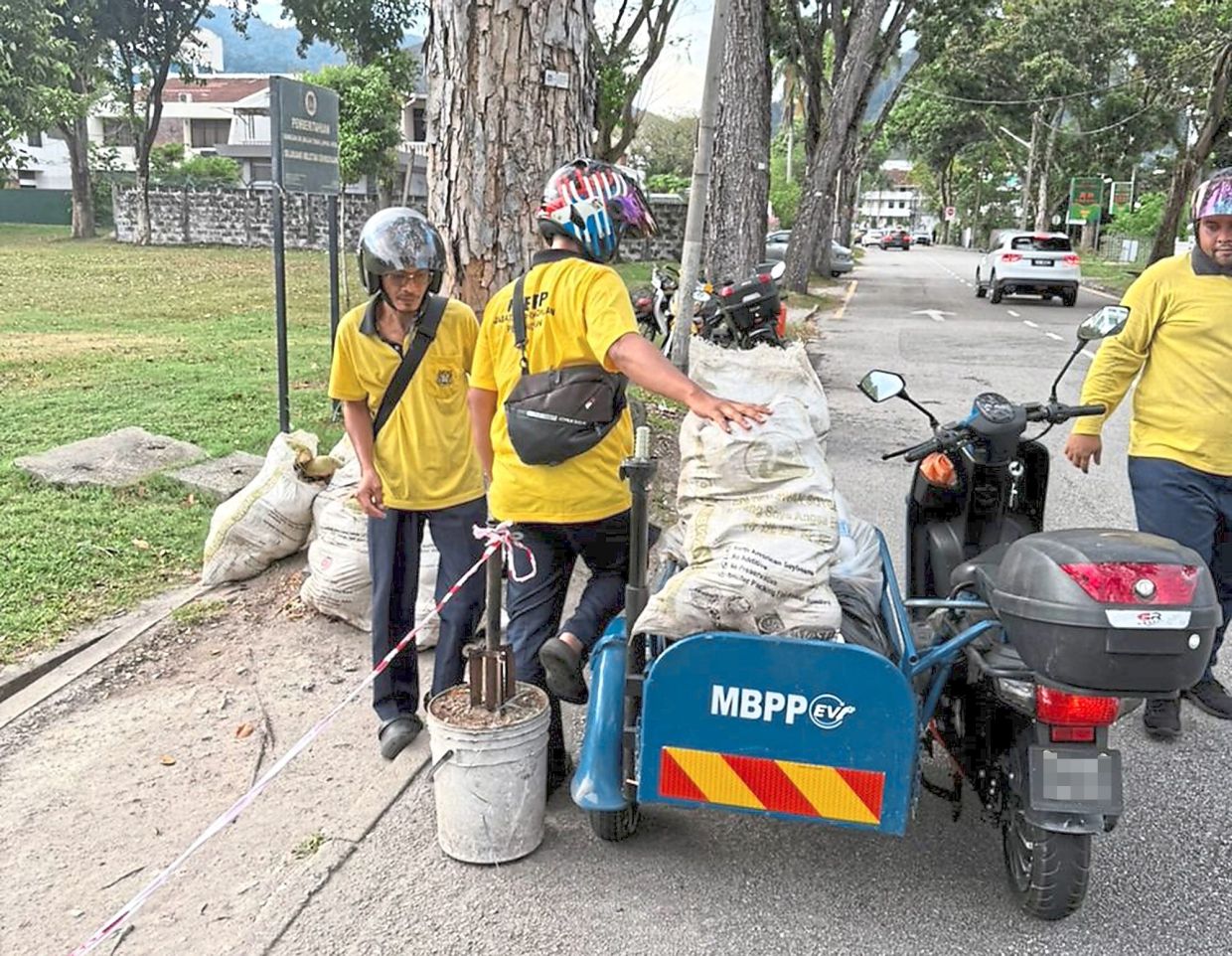 MBPP cleaners with motorcycles equipped with sidecars. — Courtesy photos